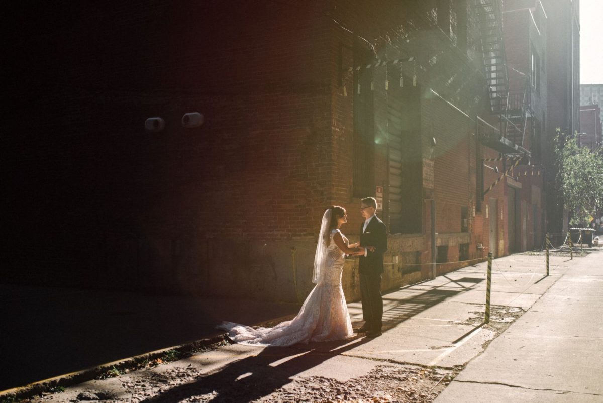 sunlight in alley wedding portrait bride and groom at heinz history center strip district pittsburgh