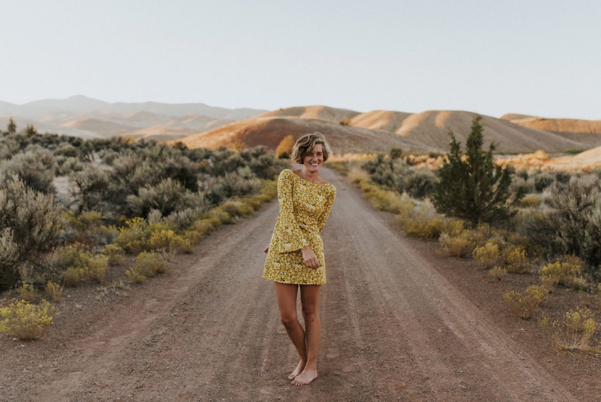 woman in yellow dress at the Painted Hills Overlook, Oregon
